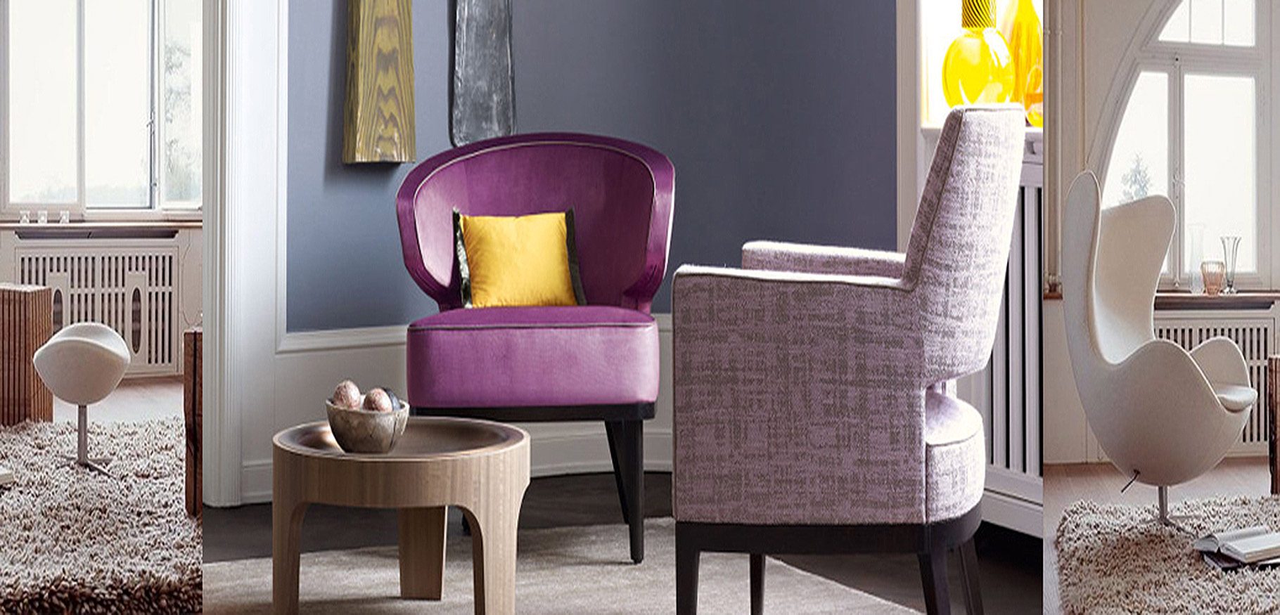 Poltrone imbottite e specchi in un ambiente dello showroom Bistolfi